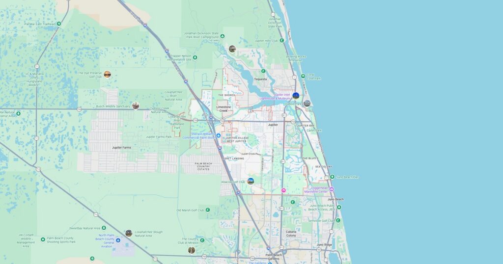 Map showing coastal city layout with roads, parks, and waterfront features, highlighting urban planning and transportation routes.