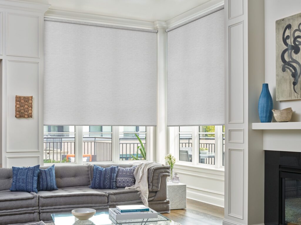 Designer Roller Shades in Abilene in a living room with a fireplace