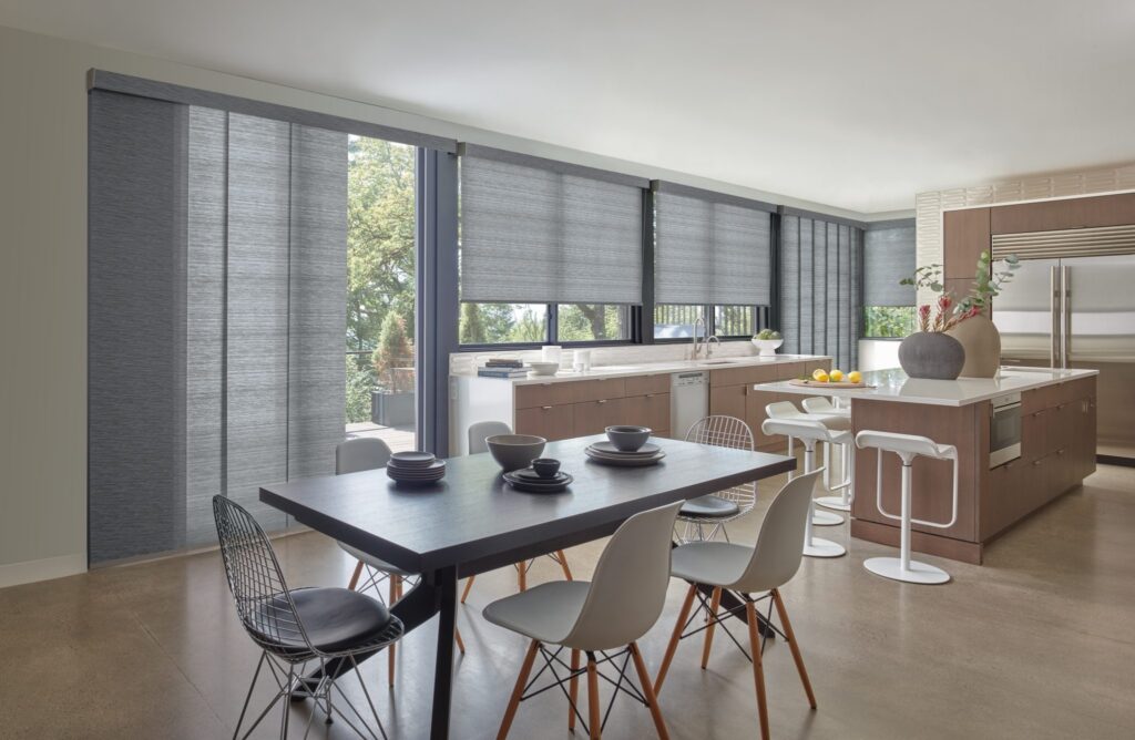 Designer Roller Shades and Skyline® Gliding Window Panels in Formosa in a kitchen