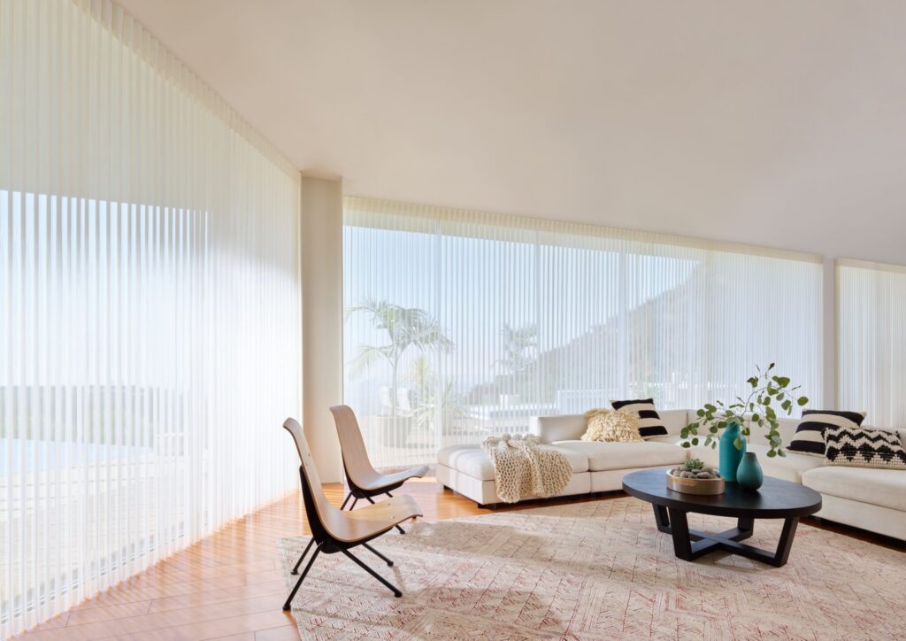 Luminette® Privacy Sheers in Stria™ with PowerView® Automation in a living room