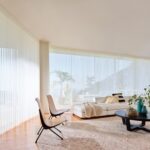 Luminette® Privacy Sheers in Stria™ with PowerView® Automation in a living room